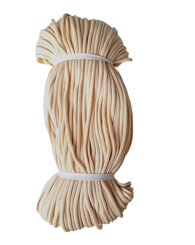 Beige rope tied into a bundle on a white background