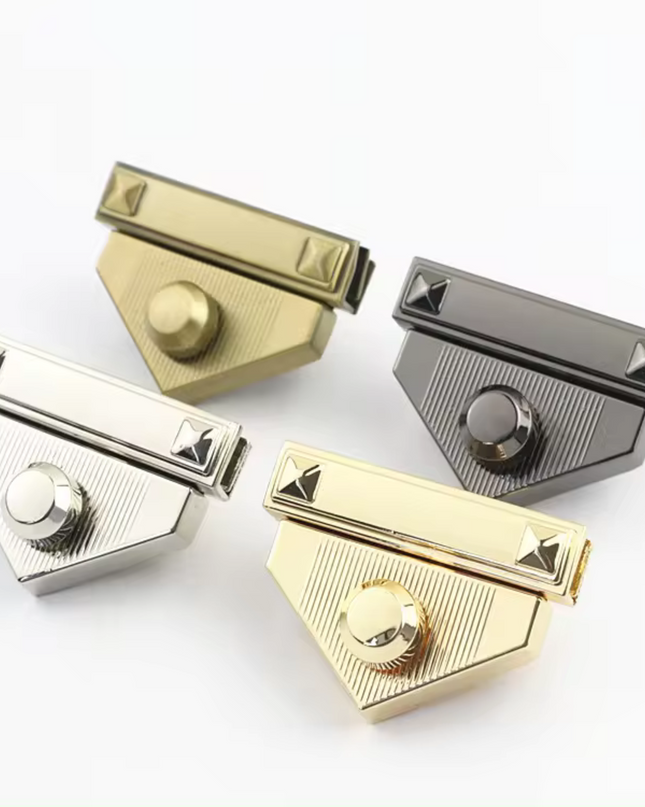 Four triangle-shaped metal turn lock clasps for crochet or knitted bags in gold, silver, antique brass, and gunmetal colors.